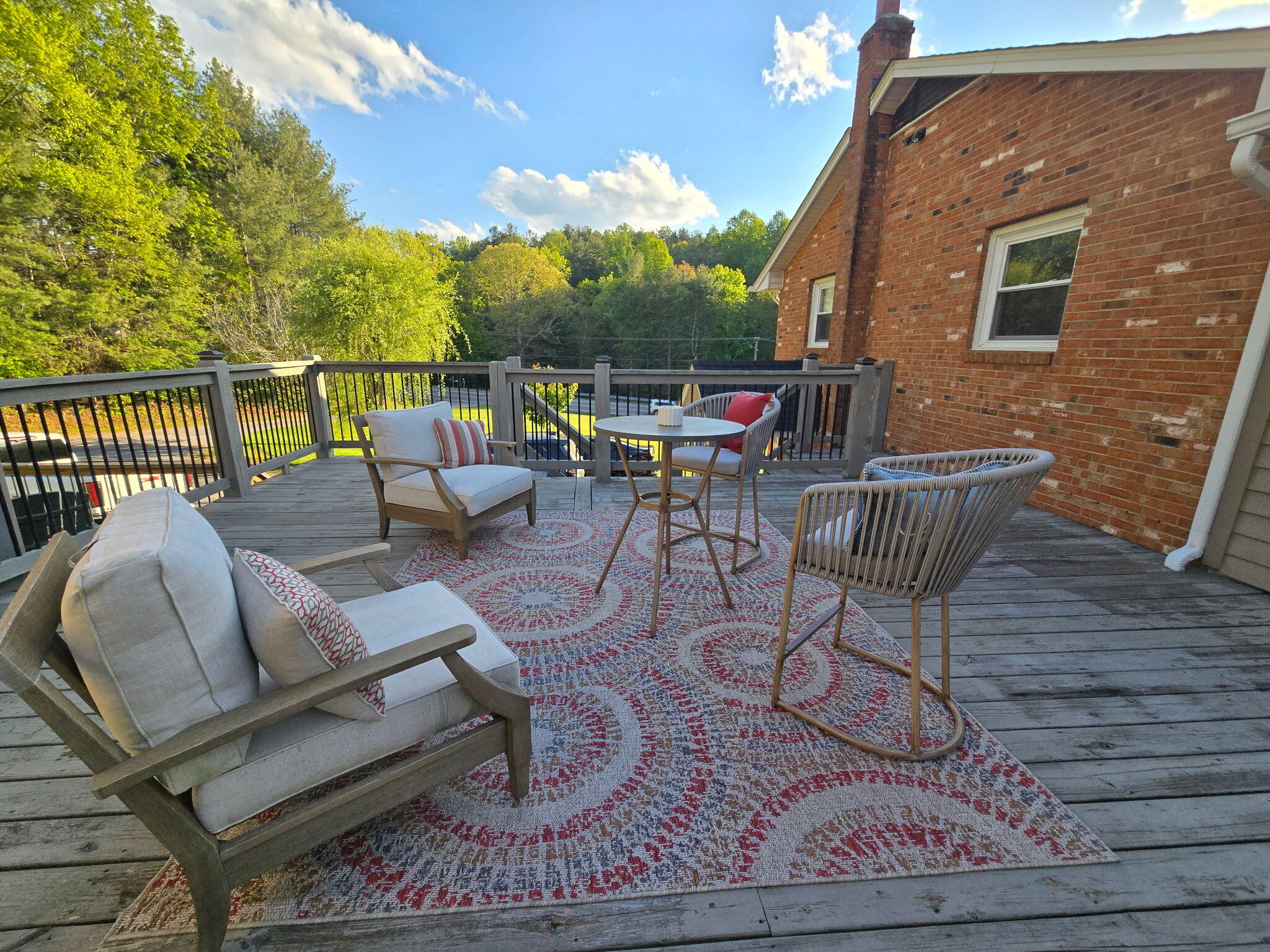 4003 Webbs Mill Road North Riner, VA 24149 - Photo 7 of 70 a roof deck with a dining table and chairs with wooden floor