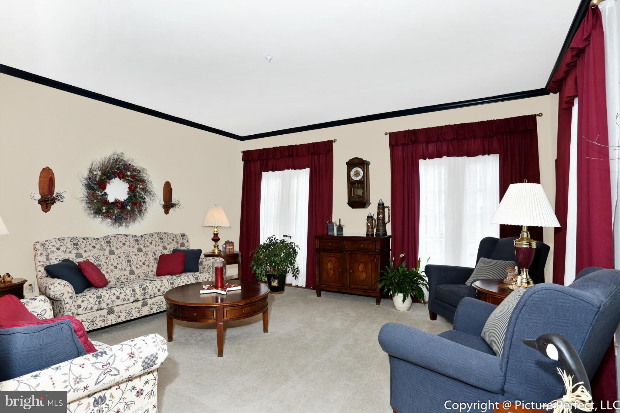 2411 Rippling Brook Road Frederick, MD 21701 - Photo 5 of 30 Formal Living Room with Hardwood Floors