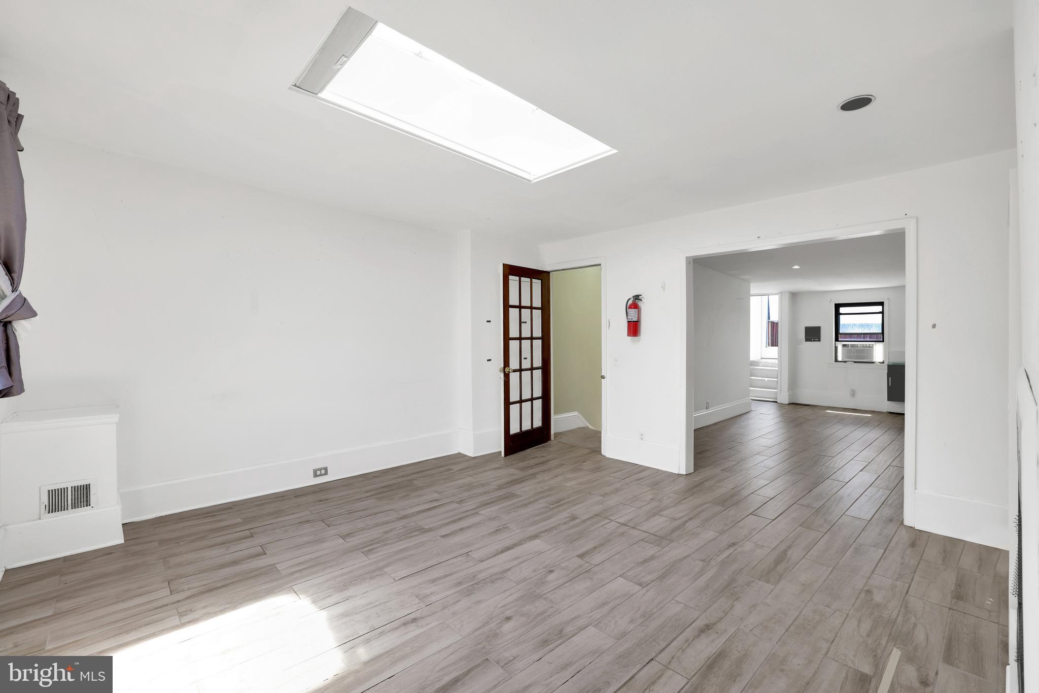 1828 California Street Northwest, Unit A Washington, DC 20009 - Photo 20 of 52 a view of a big room with wooden floor and windows