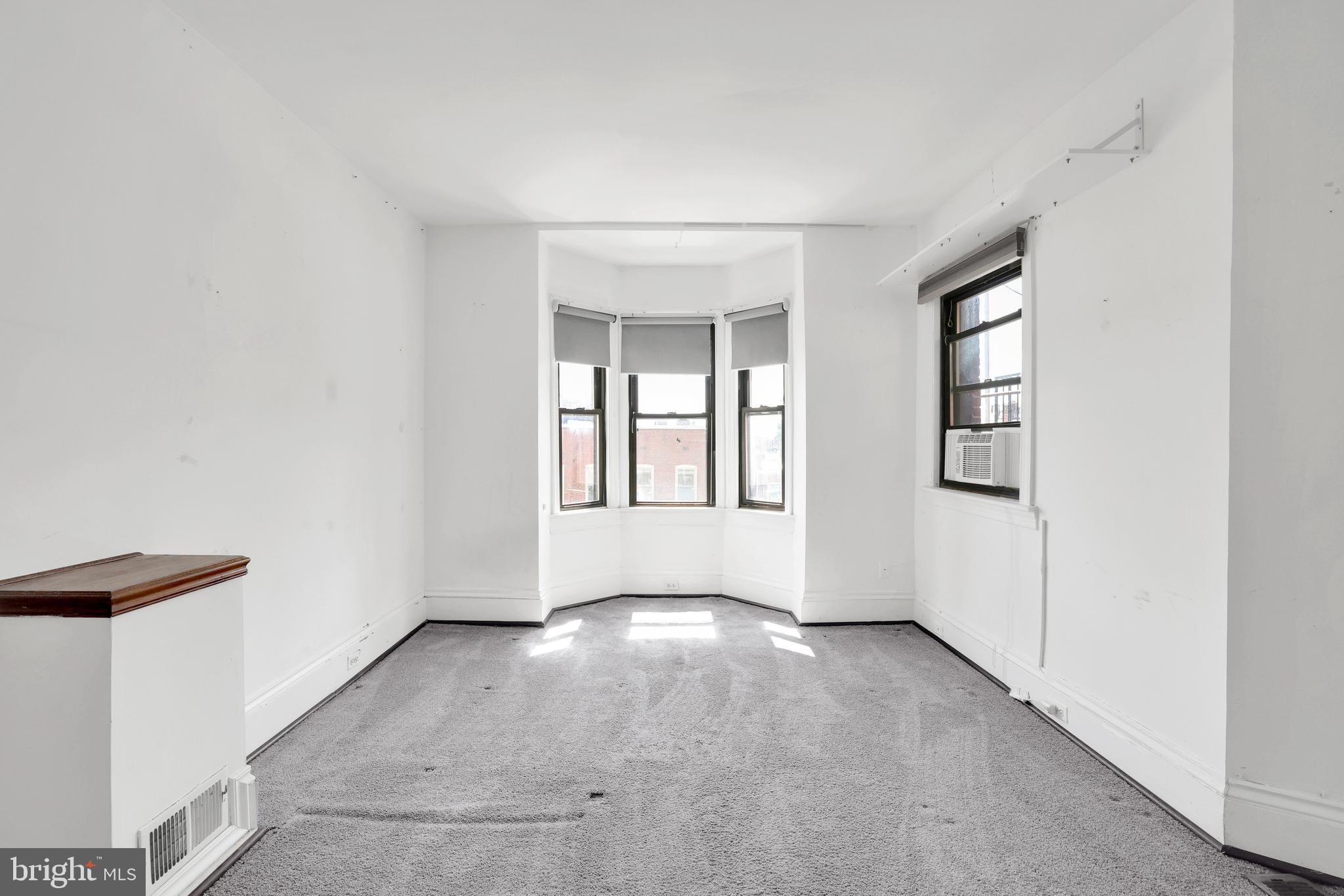 1828 California Street Northwest, Unit A Washington, DC 20009 - Photo 27 of 52 an empty room with windows