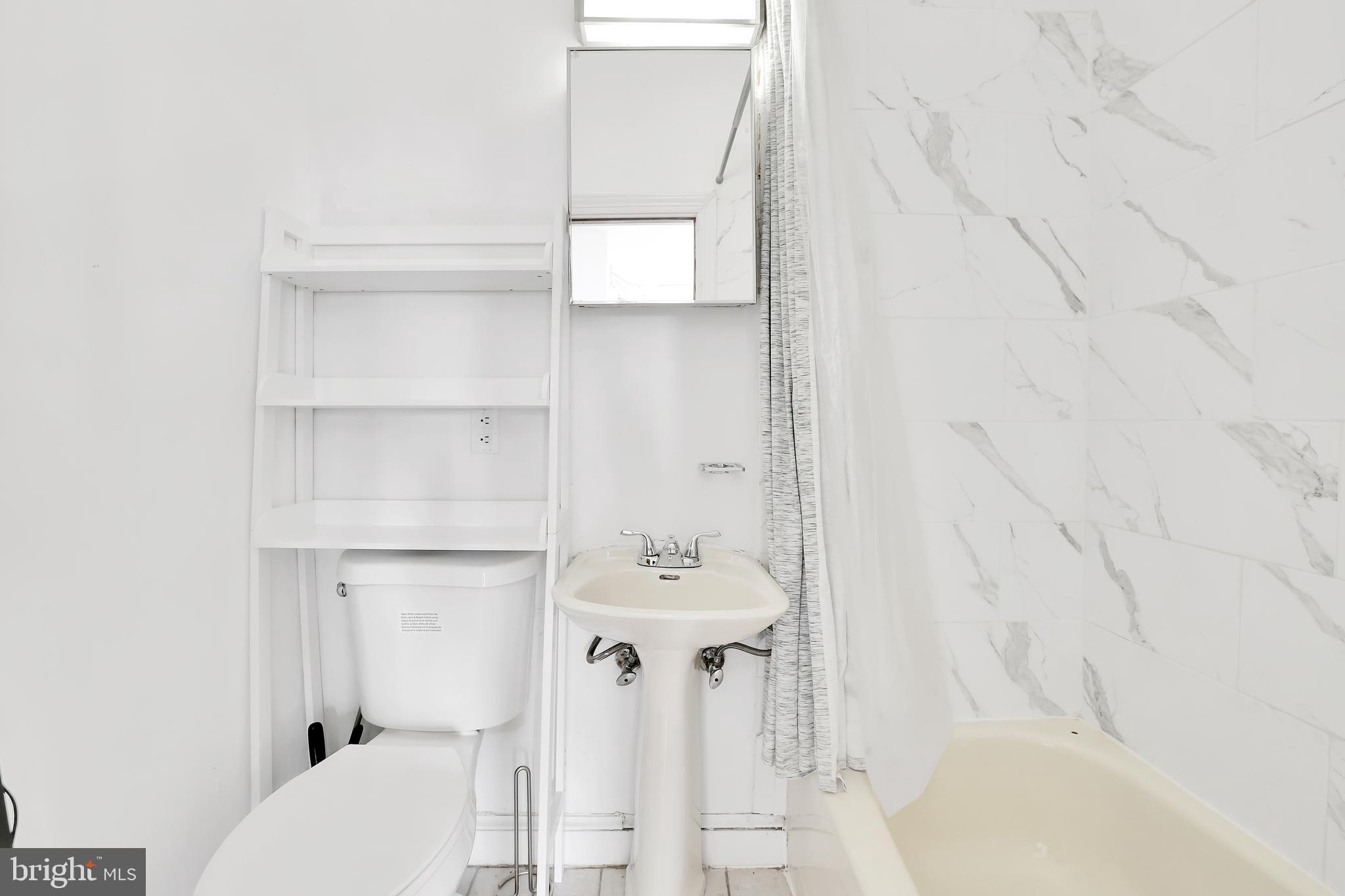 1828 California Street Northwest, Unit A Washington, DC 20009 - Photo 29 of 52 a bathroom with a sink toilet and shower