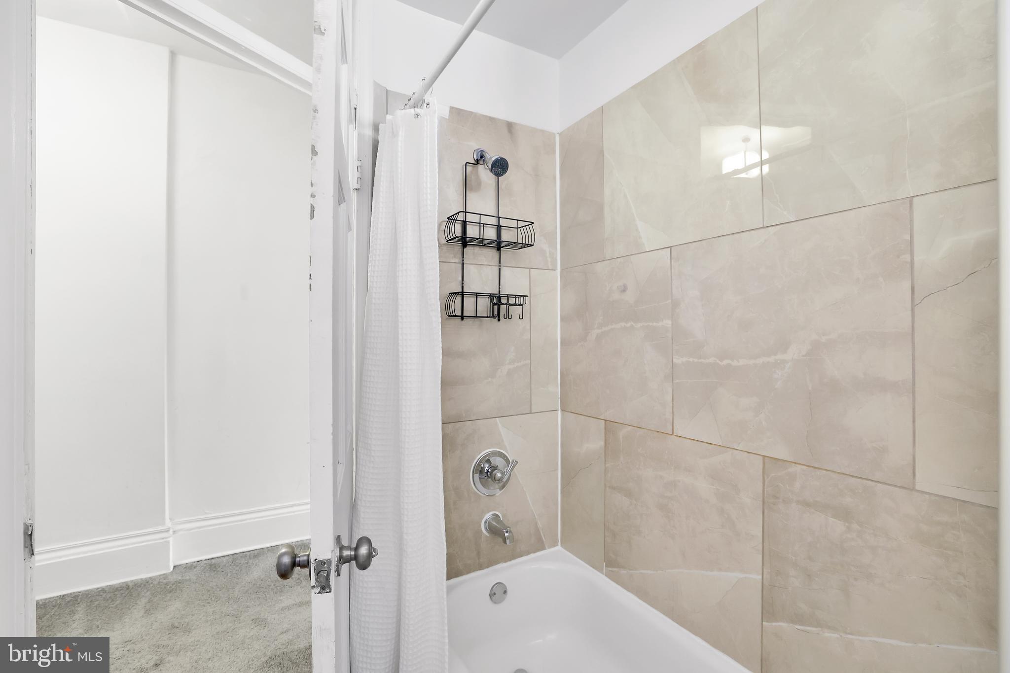 1828 California Street Northwest, Unit A Washington, DC 20009 - Photo 30 of 52 a bathroom with a bathtub and a shower