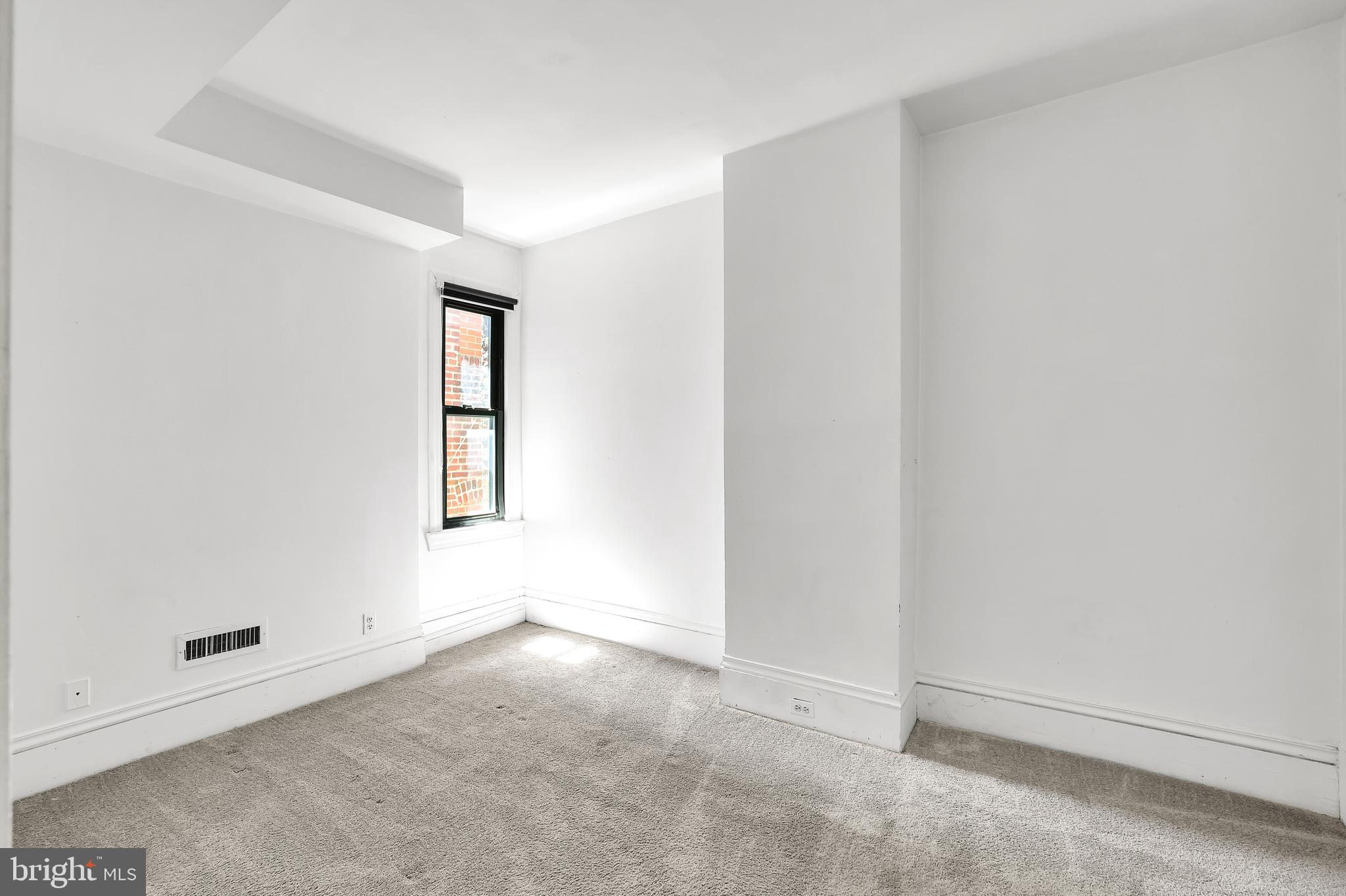 1828 California Street Northwest, Unit A Washington, DC 20009 - Photo 32 of 52 an empty room with windows and closet