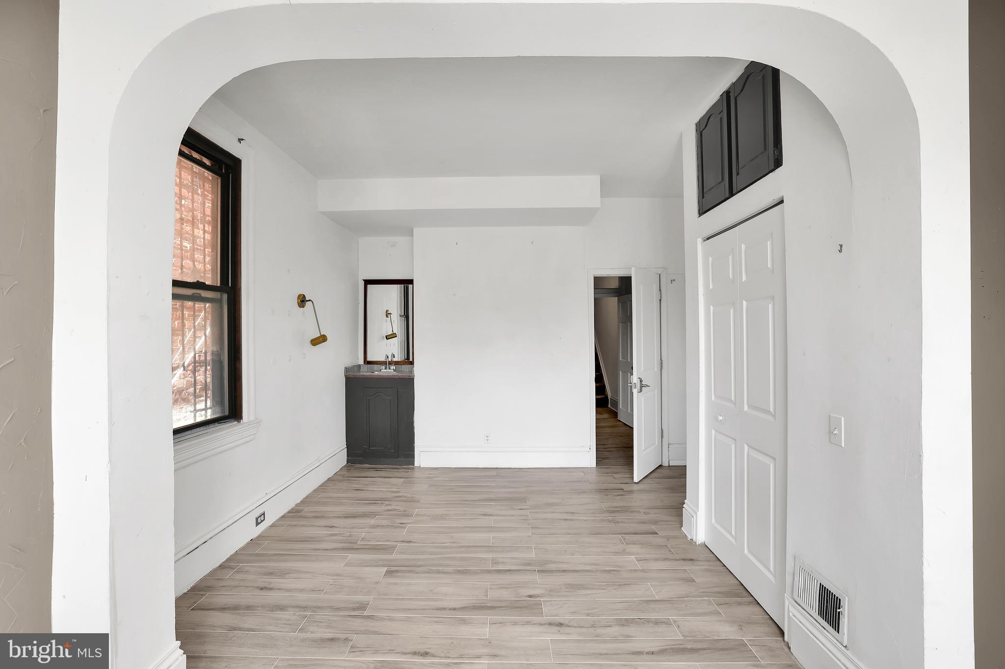 1828 California Street Northwest, Unit A Washington, DC 20009 - Photo 37 of 52 a view of a hallway with wooden floor