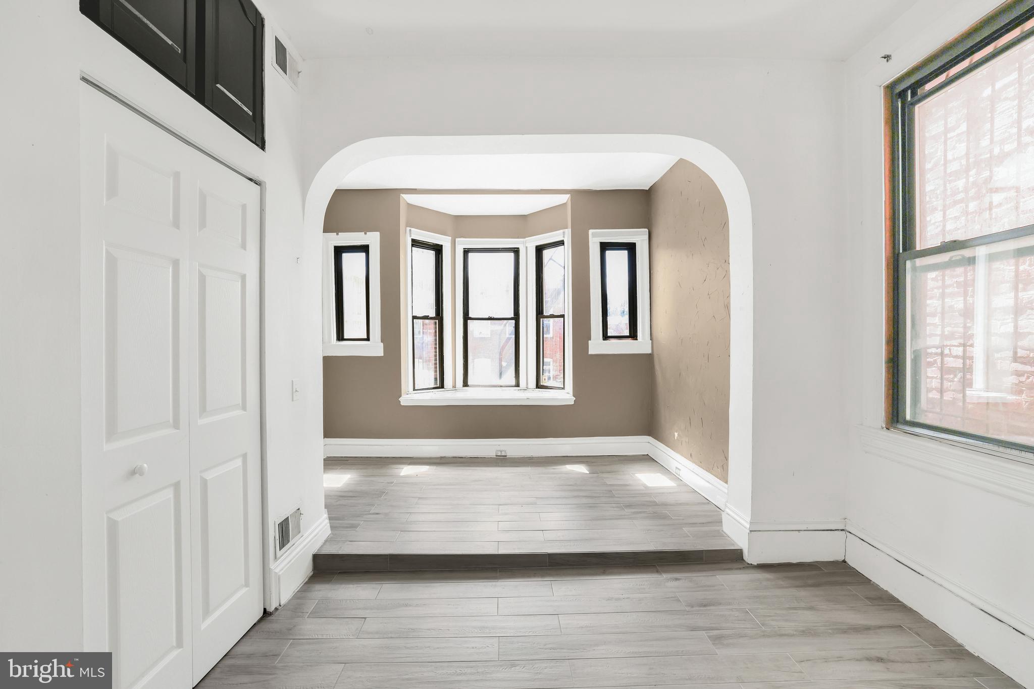 1828 California Street Northwest, Unit A Washington, DC 20009 - Photo 39 of 52 a view of an entryway with wooden floor and windows