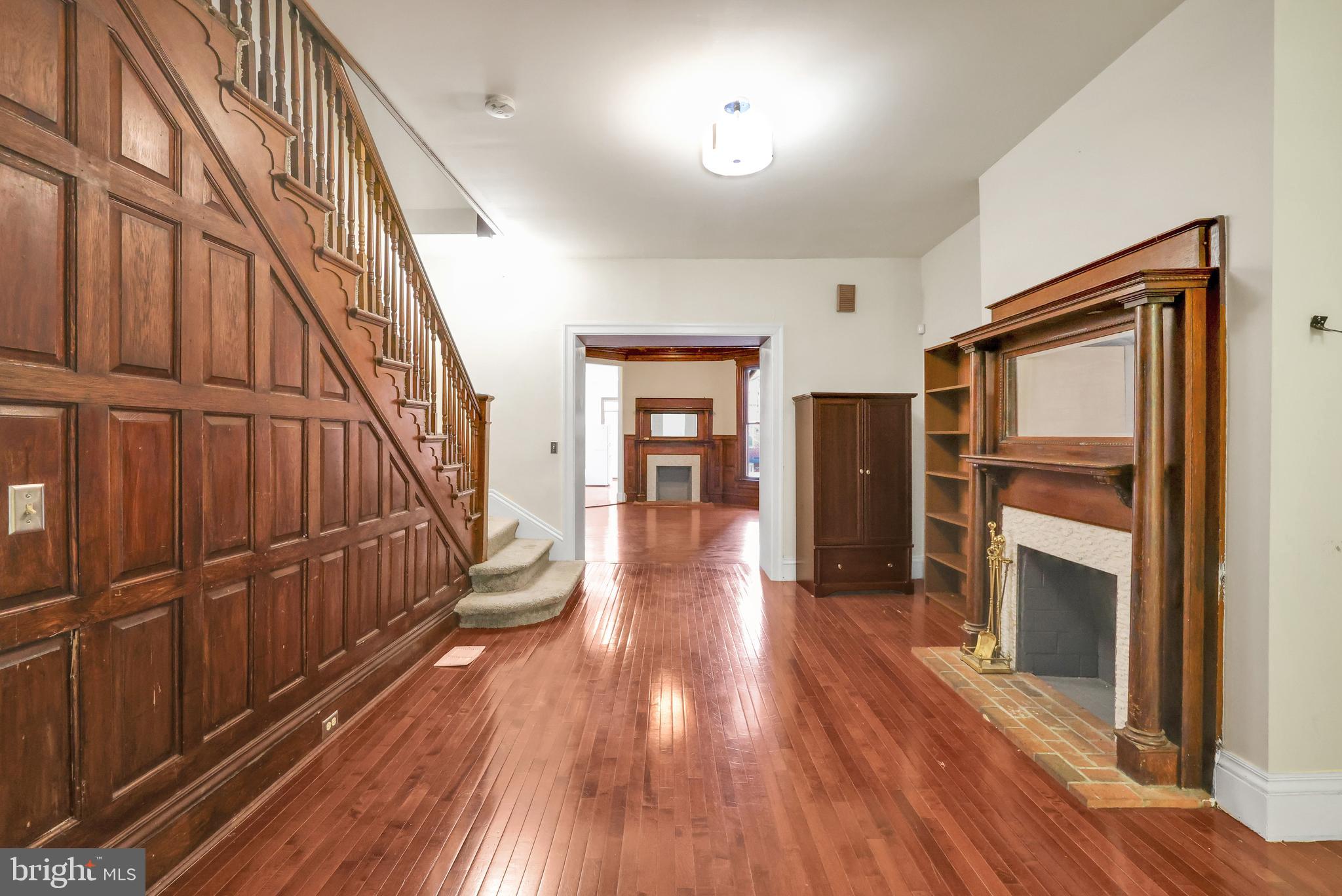 1828 California Street Northwest, Unit A Washington, DC 20009 - Photo 5 of 52 a view of a hallway with wooden floor and staircase