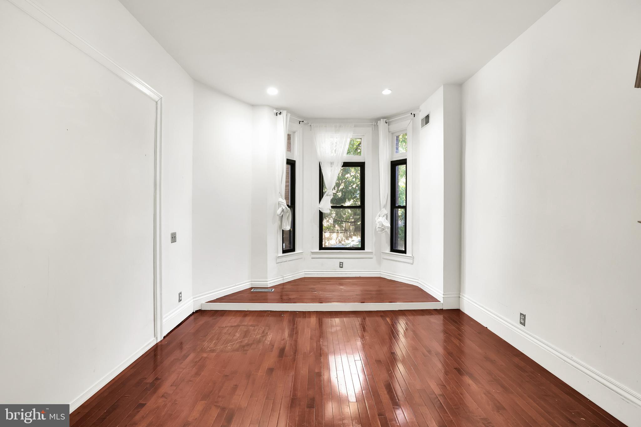 1828 California Street Northwest, Unit A Washington, DC 20009 - Photo 10 of 52 a view of livingroom with hardwood floor and window