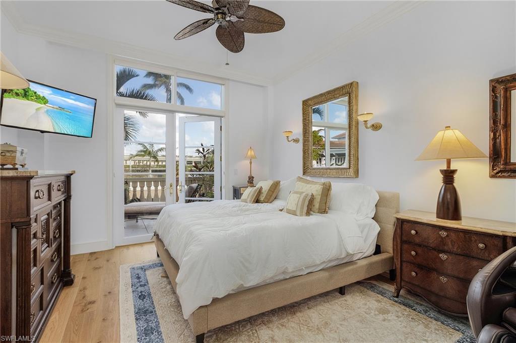 780 5th Avenue South, Unit 3 Naples, FL 34102 - Photo 15 of 28 a bedroom with a bed and a window