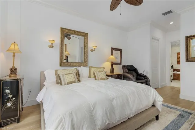 a bedroom with a bed and a night stand