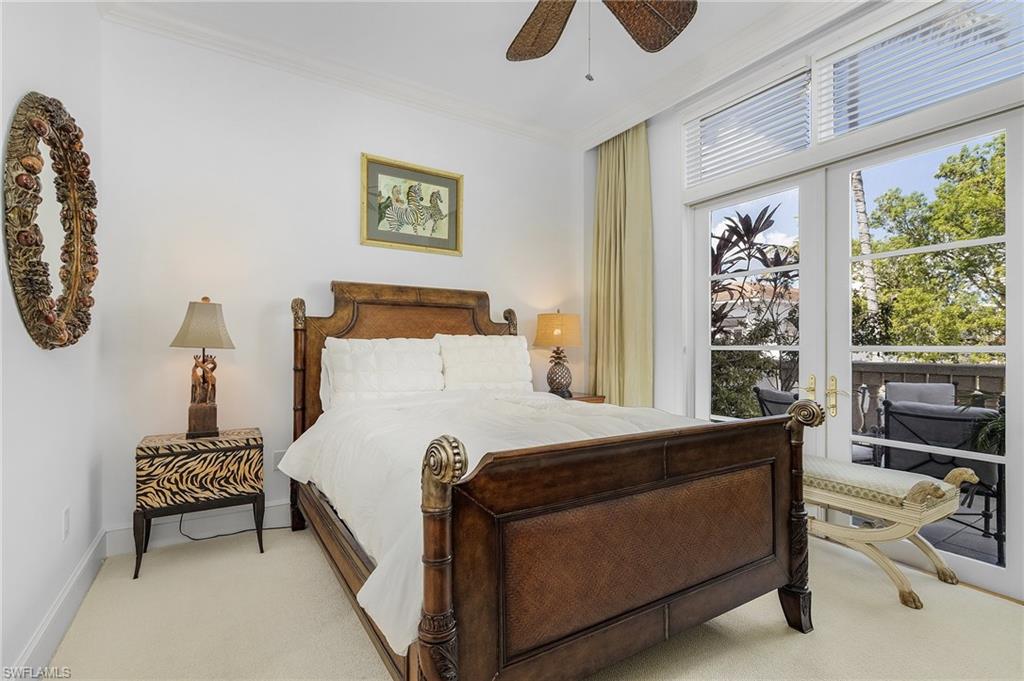 780 5th Avenue South, Unit 3 Naples, FL 34102 - Photo 19 of 28 a bedroom with a bed and a window