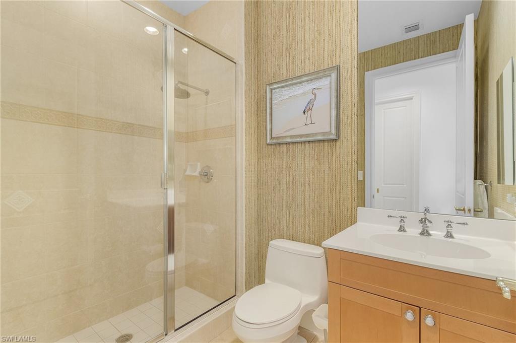 780 5th Avenue South, Unit 3 Naples, FL 34102 - Photo 21 of 28 a bathroom with a sink toilet and shower
