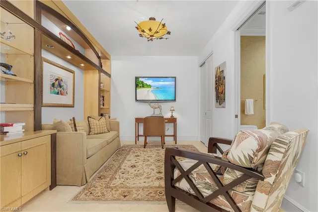 a living room with furniture and a table