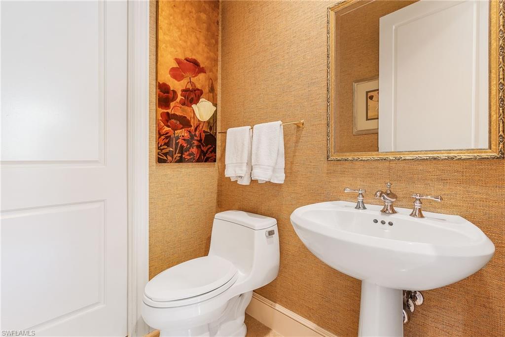 780 5th Avenue South, Unit 3 Naples, FL 34102 - Photo 23 of 28 a bathroom with a sink and a toilet