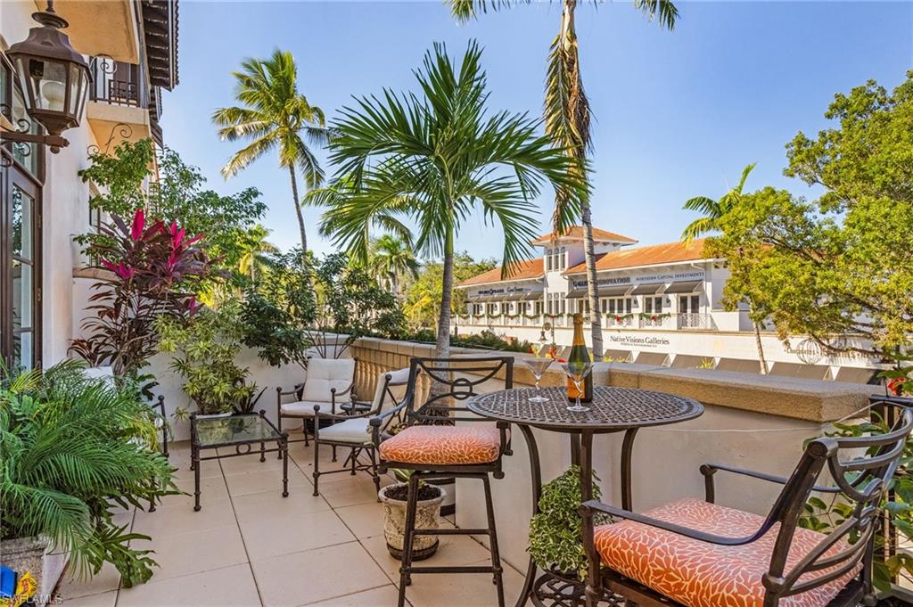 780 5th Avenue South, Unit 3 Naples, FL 34102 - Photo 24 of 28 a view of a chairs and table in patio