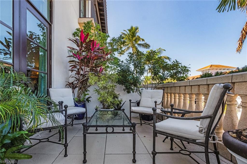 780 5th Avenue South, Unit 3 Naples, FL 34102 - Photo 26 of 28 a view of chair and tables