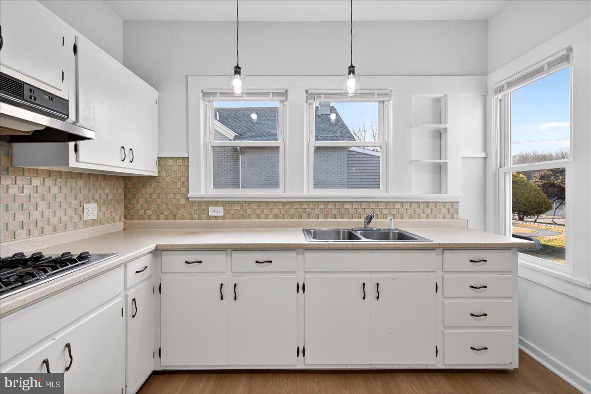 615 13th Street New Castle, DE 19720 - Photo 14 of 39 a kitchen with a sink and cabinets