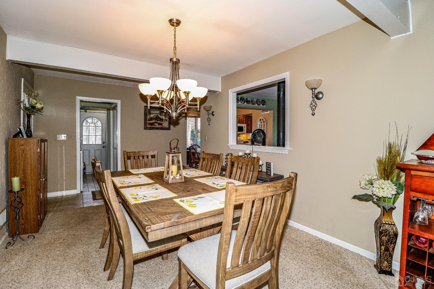 3 Frances Road Edison, NJ 08820 - Photo 13 of 33 a dining room with furniture a chandelier and wooden floor