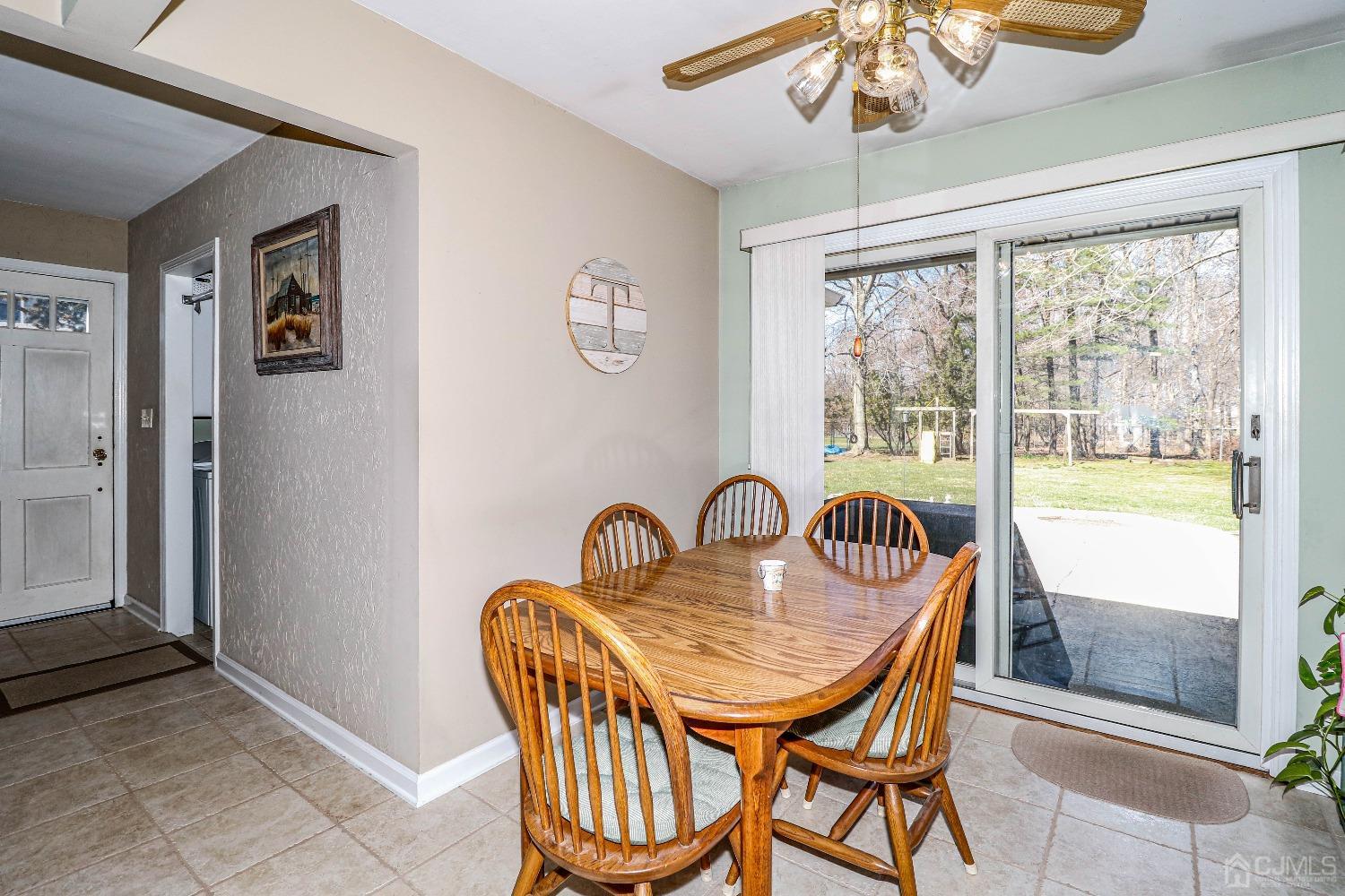 3 Frances Road Edison, NJ 08820 - Photo 14 of 33 a dining room with furniture a chandelier and window