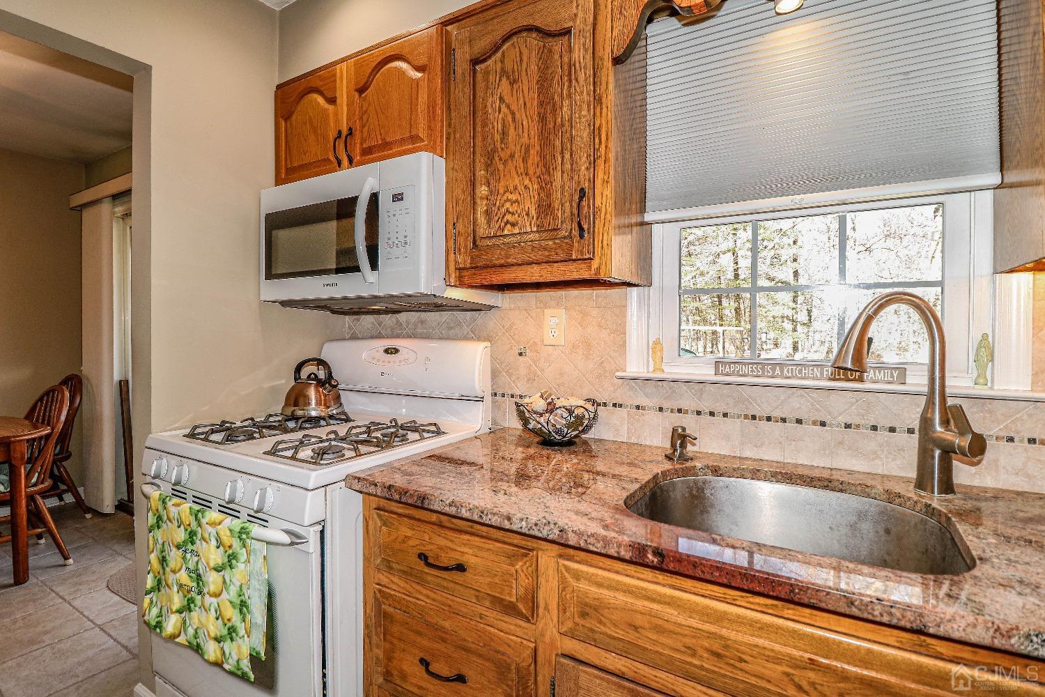 3 Frances Road Edison, NJ 08820 - Photo 18 of 33 a kitchen with stainless steel appliances granite countertop a sink stove and cabinets