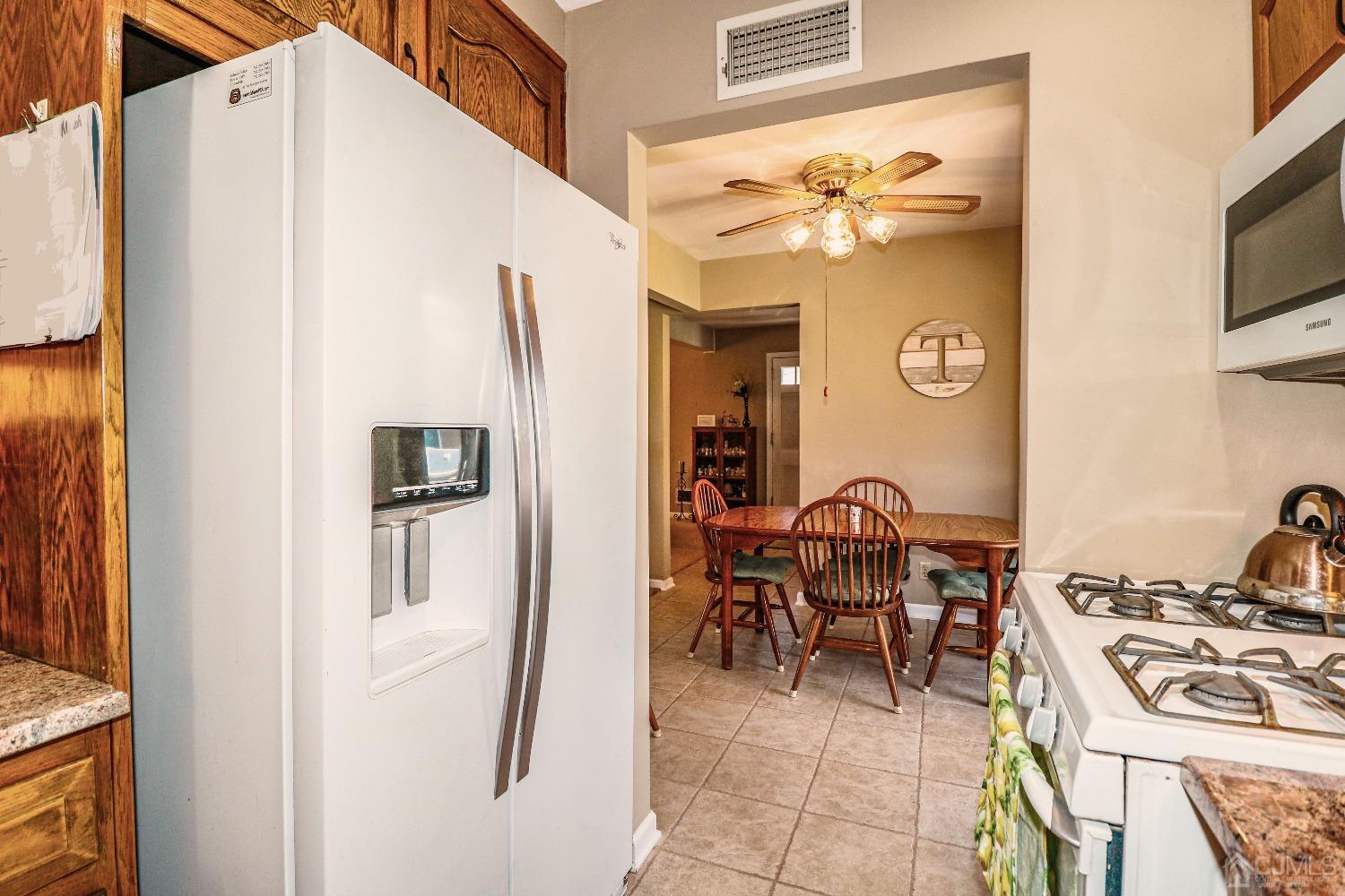 3 Frances Road Edison, NJ 08820 - Photo 19 of 33 a dining room with furniture and chandelier