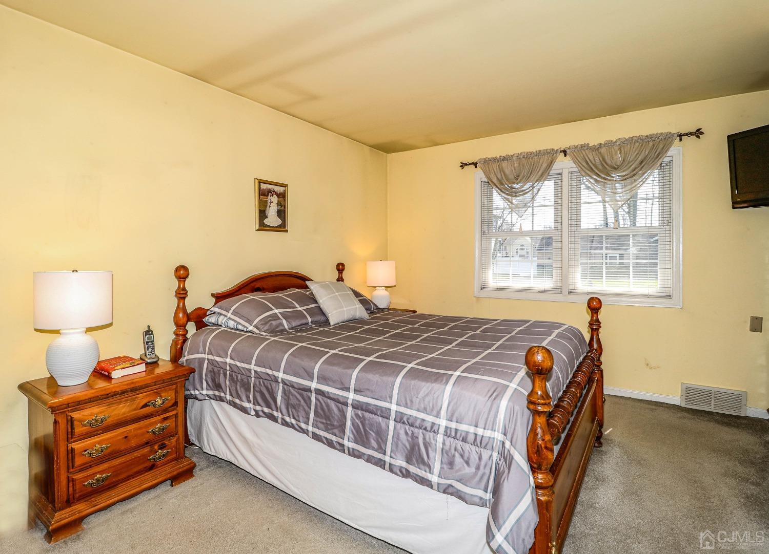 3 Frances Road Edison, NJ 08820 - Photo 23 of 33 a bedroom with a bed and wooden floor