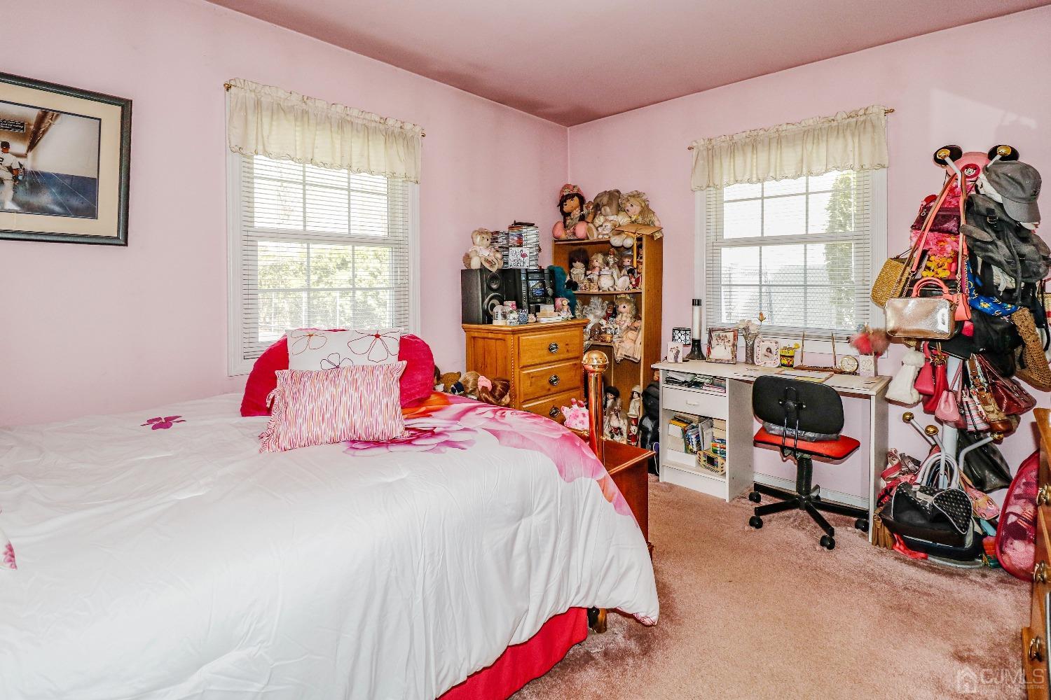 3 Frances Road Edison, NJ 08820 - Photo 27 of 33 a bedroom with a bed a dresser and a window