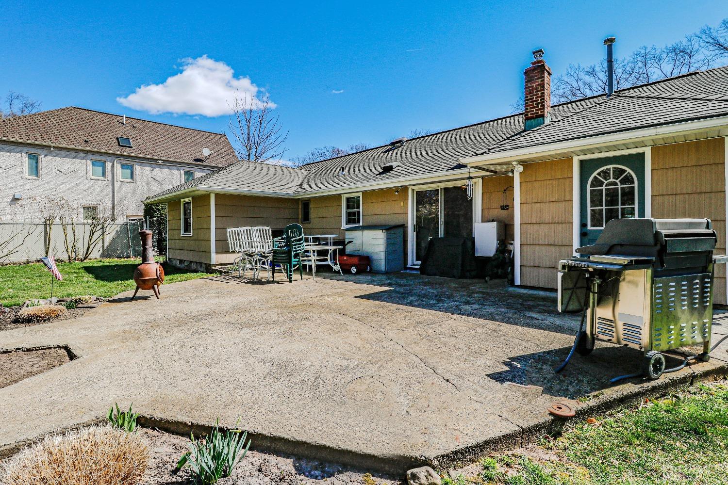 3 Frances Road Edison, NJ 08820 - Photo 29 of 33 a view of a patio with table and chairs under an umbrella