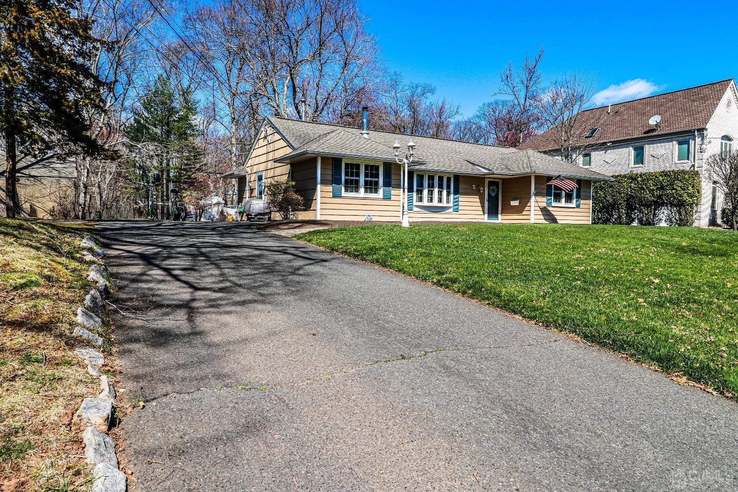 3 Frances Road Edison, NJ 08820 - Photo 3 of 33 a front view of a house with a garden