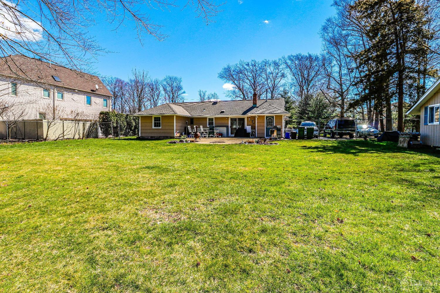 3 Frances Road Edison, NJ 08820 - Photo 31 of 33 a front view of a house with a garden and trees