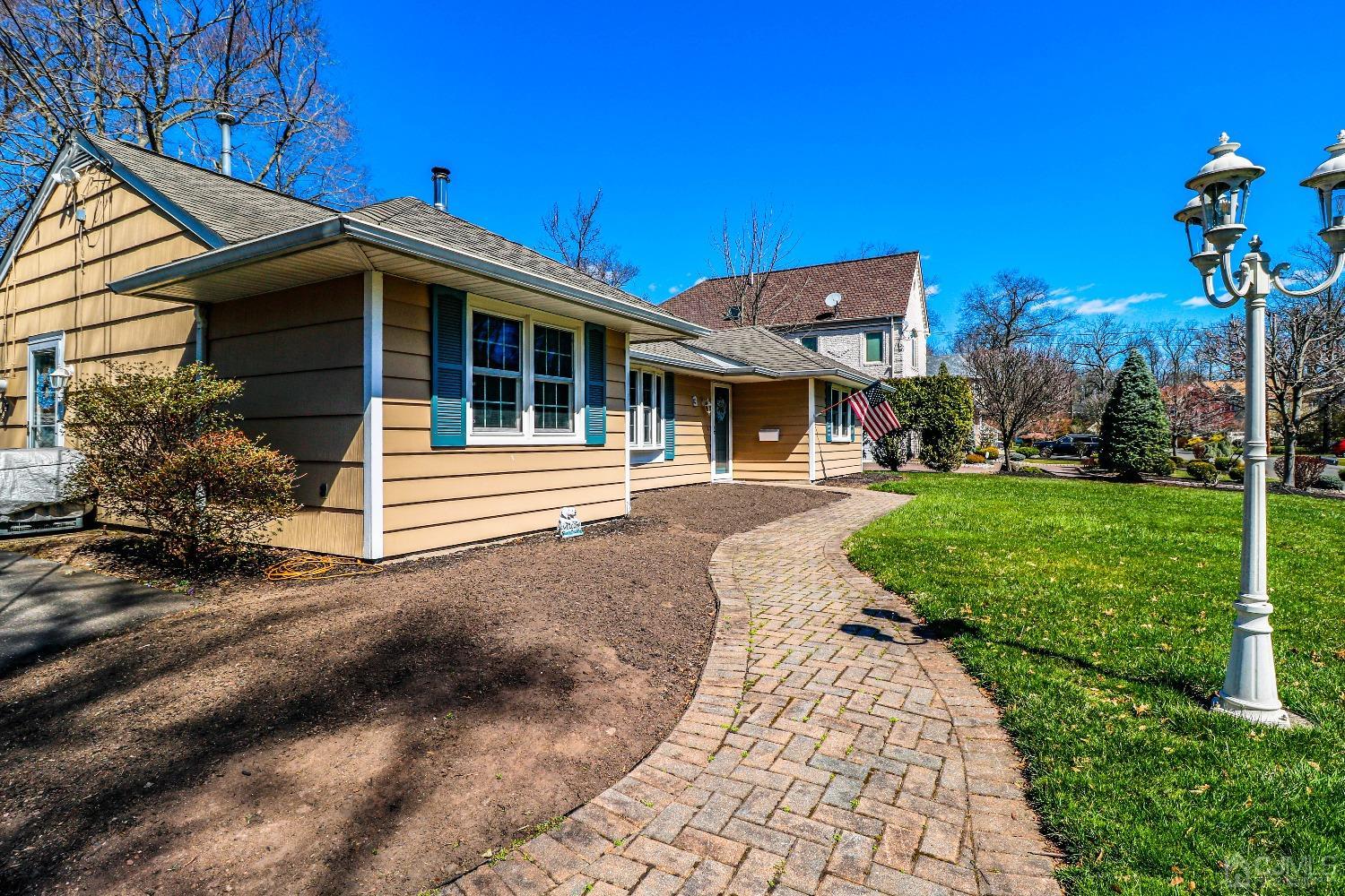 3 Frances Road Edison, NJ 08820 - Photo 4 of 33 a front view of a house with a yard