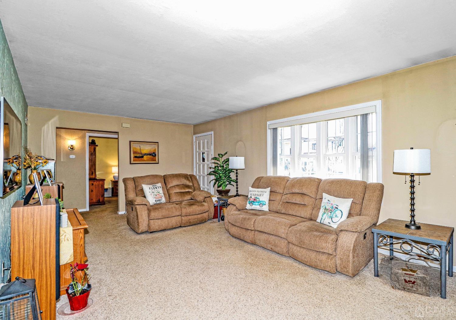 3 Frances Road Edison, NJ 08820 - Photo 9 of 33 a living room with furniture and a window