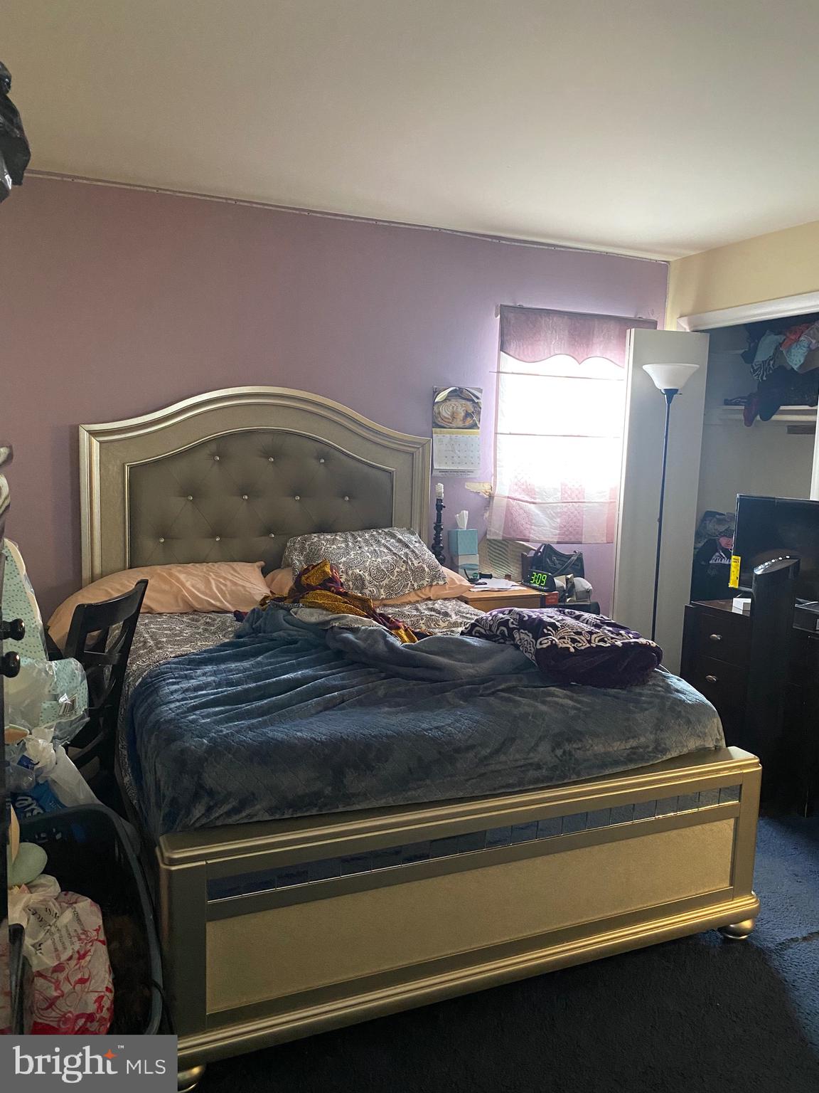 7907 Good Luck Road Lanham, MD 20706 - Photo 13 of 36 a bedroom with a bed and lamp