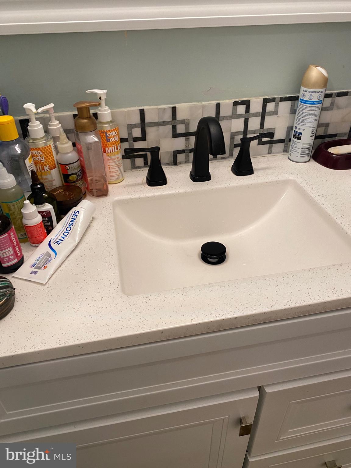 7907 Good Luck Road Lanham, MD 20706 - Photo 16 of 36 a bathroom with a sink and a mirror