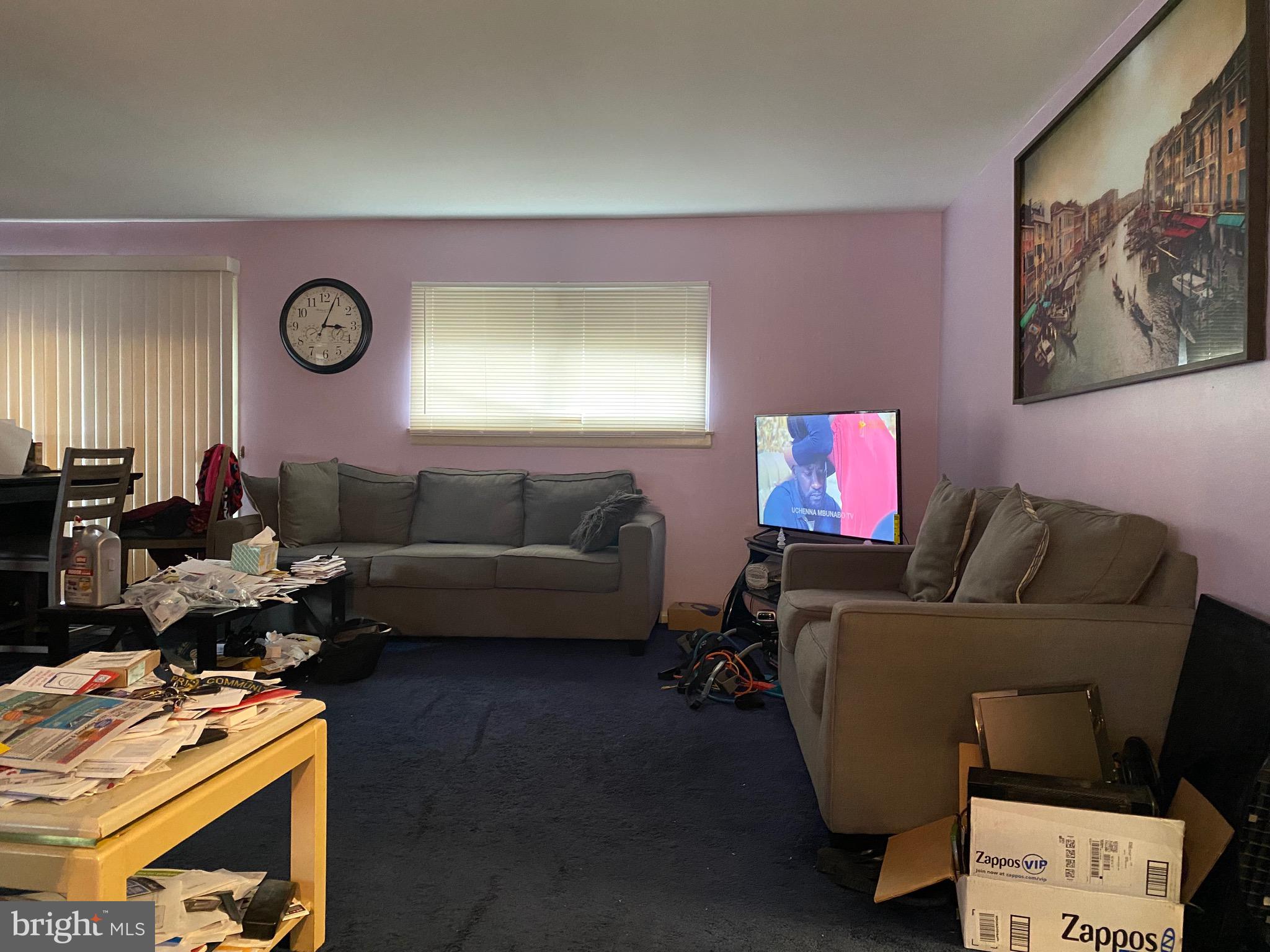 7907 Good Luck Road Lanham, MD 20706 - Photo 2 of 36 a living room with furniture and a flat screen tv