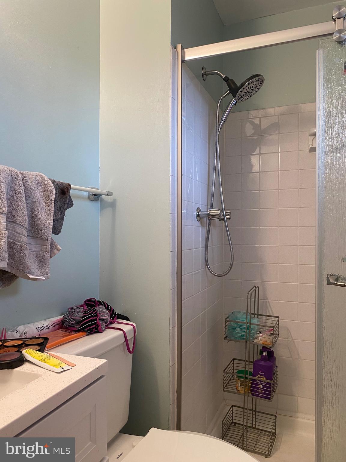 7907 Good Luck Road Lanham, MD 20706 - Photo 21 of 36 a bathroom with a granite countertop sink mirror vanity and toilet