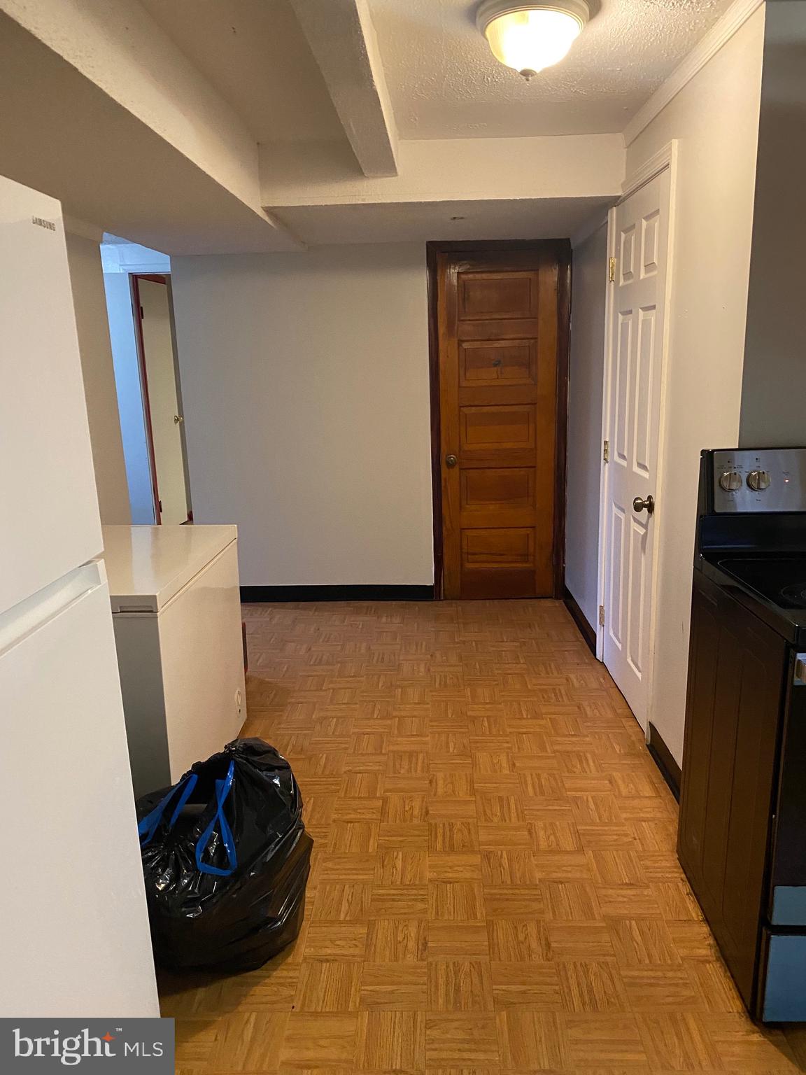 7907 Good Luck Road Lanham, MD 20706 - Photo 29 of 36 a view of an empty room with wooden floor and a window