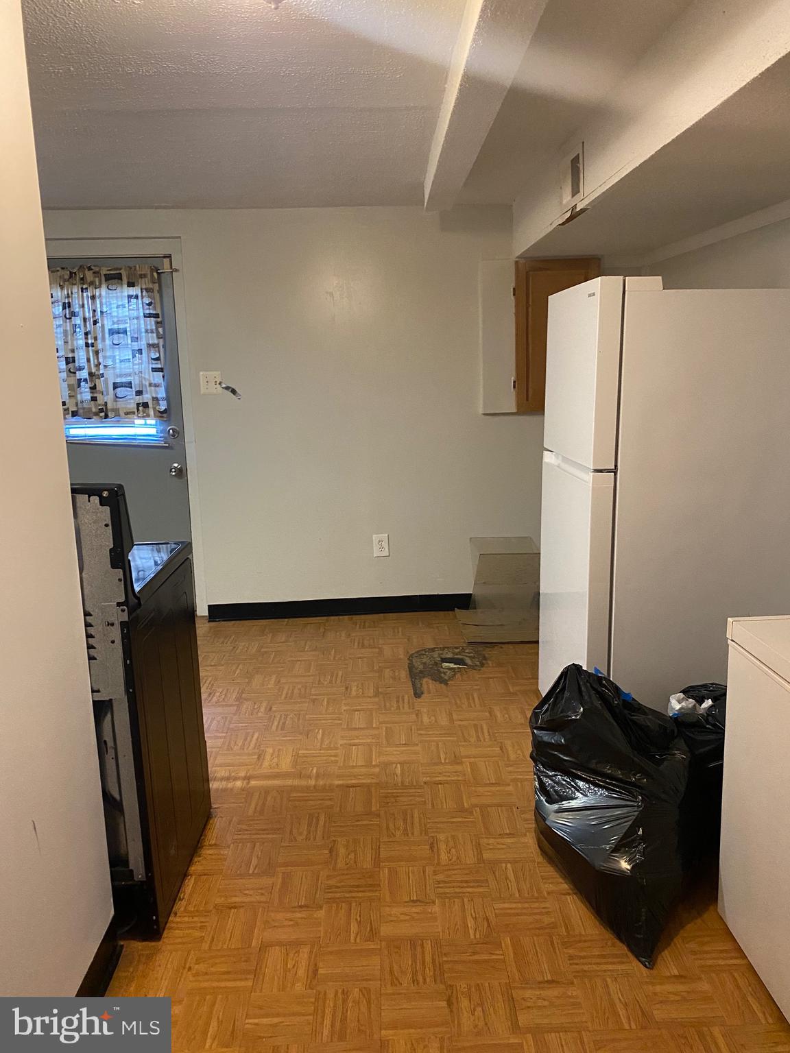 7907 Good Luck Road Lanham, MD 20706 - Photo 31 of 36 a living room with a couch and a flat screen tv