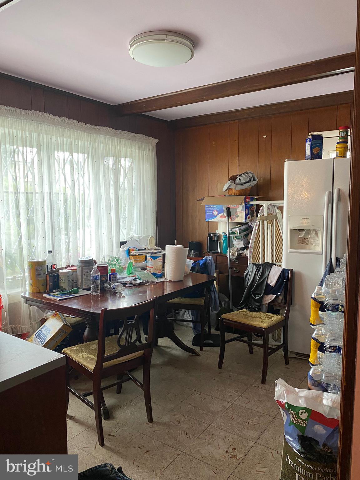 7907 Good Luck Road Lanham, MD 20706 - Photo 7 of 36 a view of a workspace with furniture and rug in a room