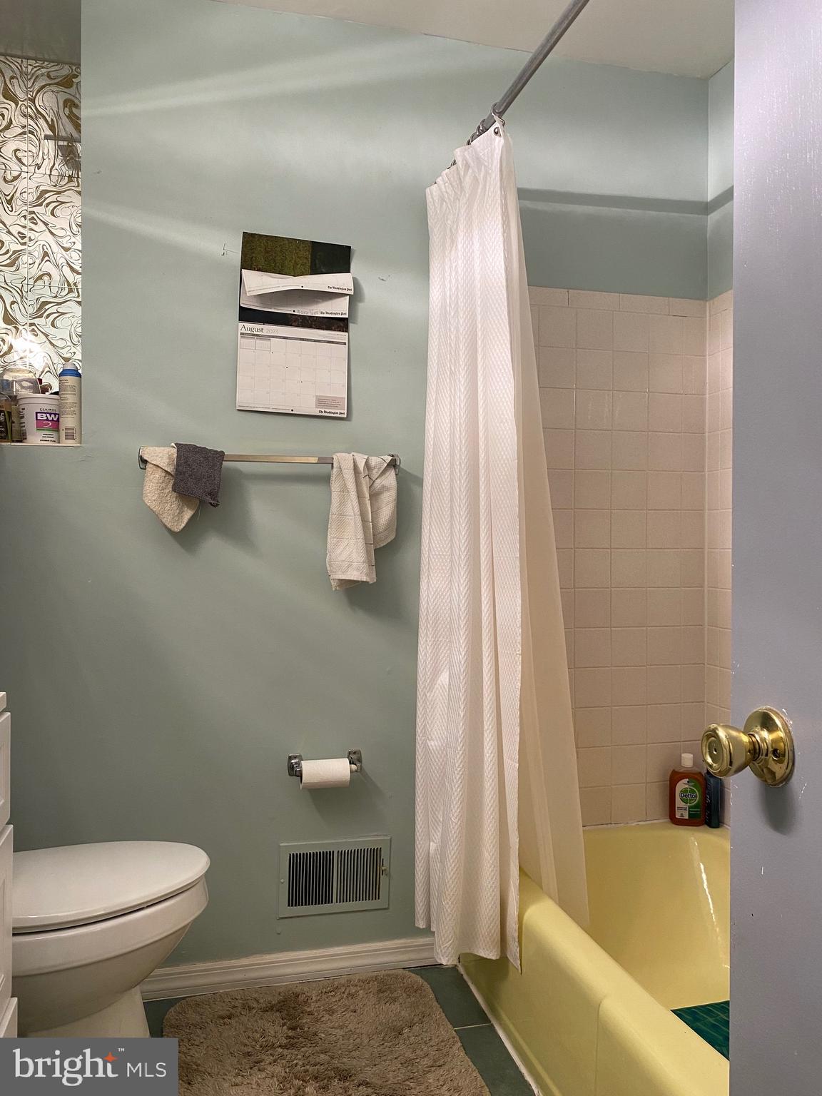 7907 Good Luck Road Lanham, MD 20706 - Photo 10 of 36 a bathroom with a sink and bathtub with toilet