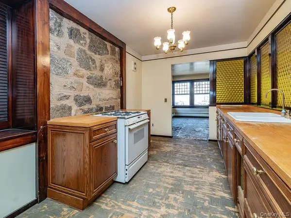 a kitchen with a stove and a sink