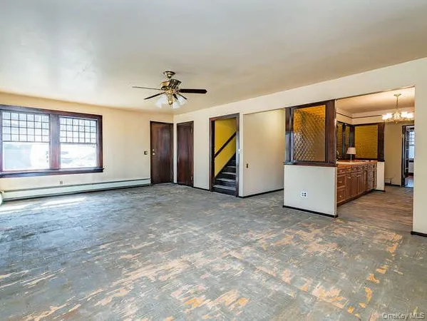 a view of an empty room with a window