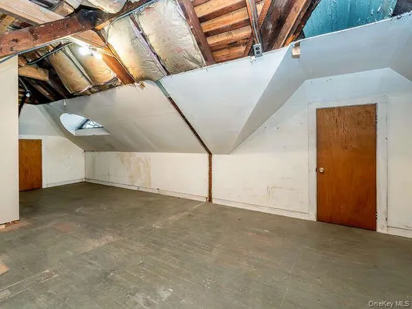 a view of an empty room with windows