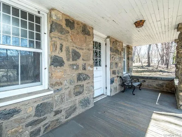 a view of a livingroom with furniture and windows