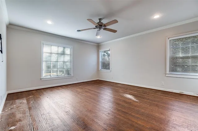 a spacious bathroom with a tub sink and mirror