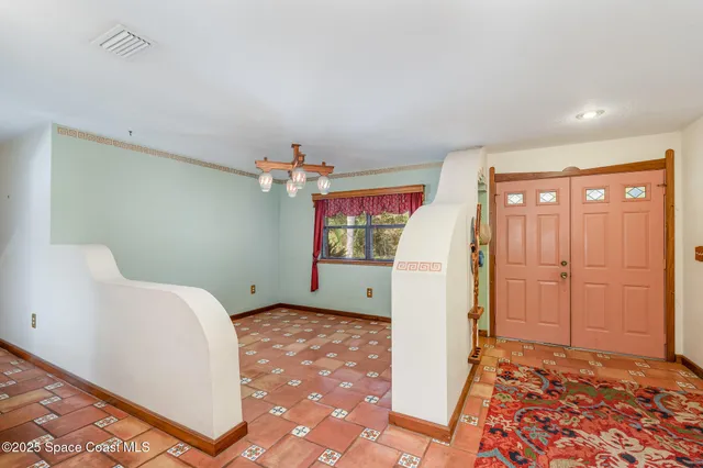 a view of a hallway with entryway