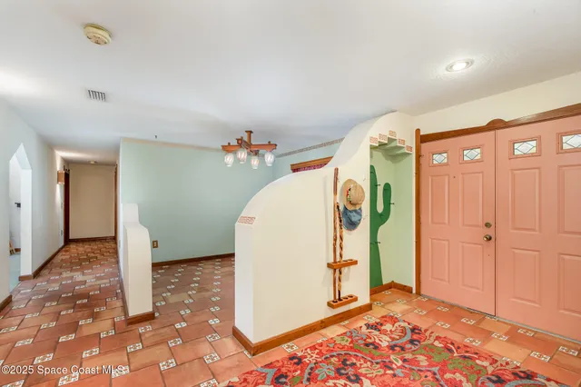 a view of a kitchen with a stove and a window
