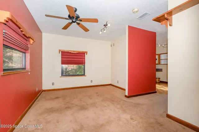 a view of a patio with table and chairs a barbeque grill with wooden fence