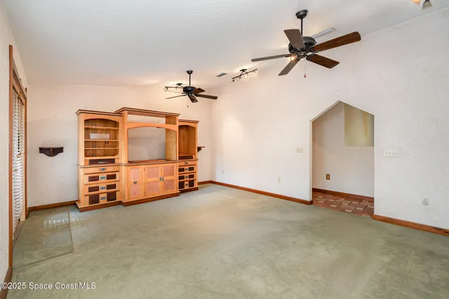 a view of a livingroom with a ceiling fan