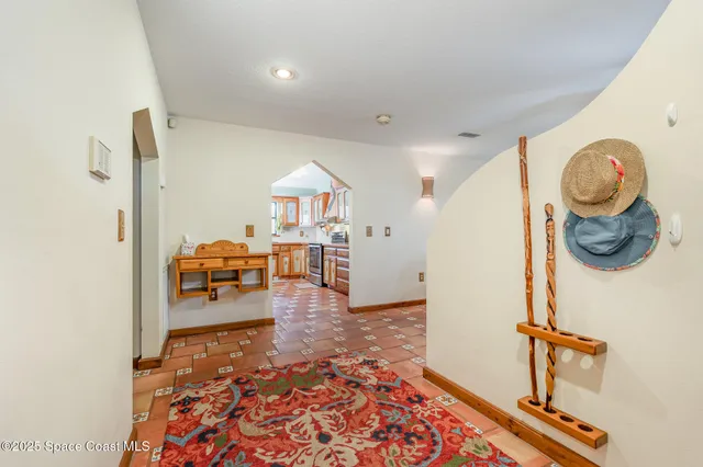 a view of living room filled with furniture and wooden floor
