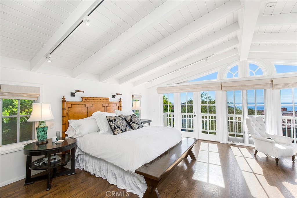 806 Emerald Bay Laguna Beach, CA 92651 - Photo 12 of 33 a bedroom with a bed and wooden floor